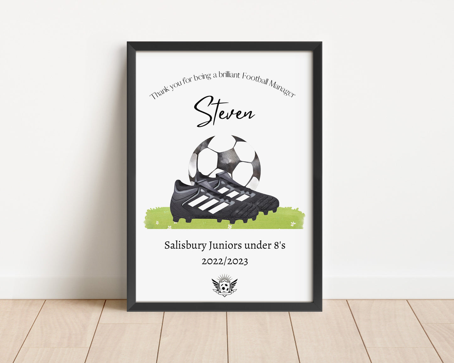 Personalised football print featuring the title ‘Coach’ or ‘Manager’ with the recipient’s name, team name, year, and team logo. The design includes a watercolour-style illustration of a football boot and ball, combining text and imagery in a sporty, artistic layout.